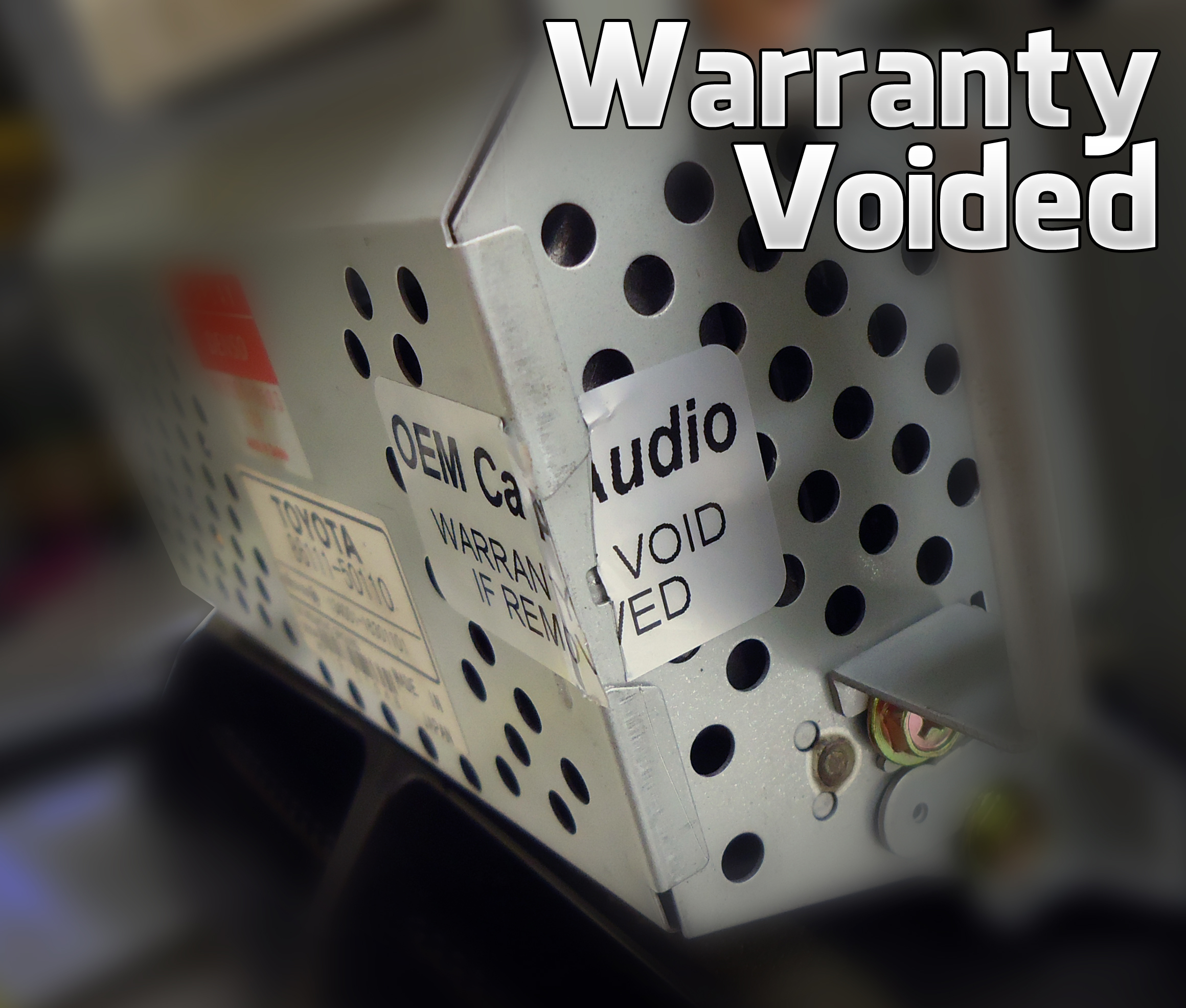 A torn Original Car Audio warranty sticker on a radio case that has been opened